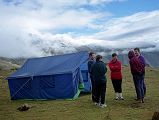 8 1 Outside Mess Tent At Dhampu After Theft As I drank my tea the next morning, I heard Shane cursing profusely. �Those bastards, they stole my hiking boots, my Gore-Tex jacket, and even my Tibetan phrase book.� She was fuming, and quite rightly so. �I left them in the vestibule of my tent which was zipped up. I can�t believe it. I can�t believe it�. Tashi walked over and Shane went through what was stolen. Kumar and Tashi then walked to the other tents to see if anything else was stolen. Gerhardt and Valerie weren�t so lucky; he lost his Gore-Tex jacket while she had her hiking boots stolen. Kumar walked back to Shane and Valerie and told them it probably was the local villagers, and that nothing could be done. He asked them if we needed to go back to Kharta to try and find new shoes, but luckily both Shane and Valerie had running shoes.